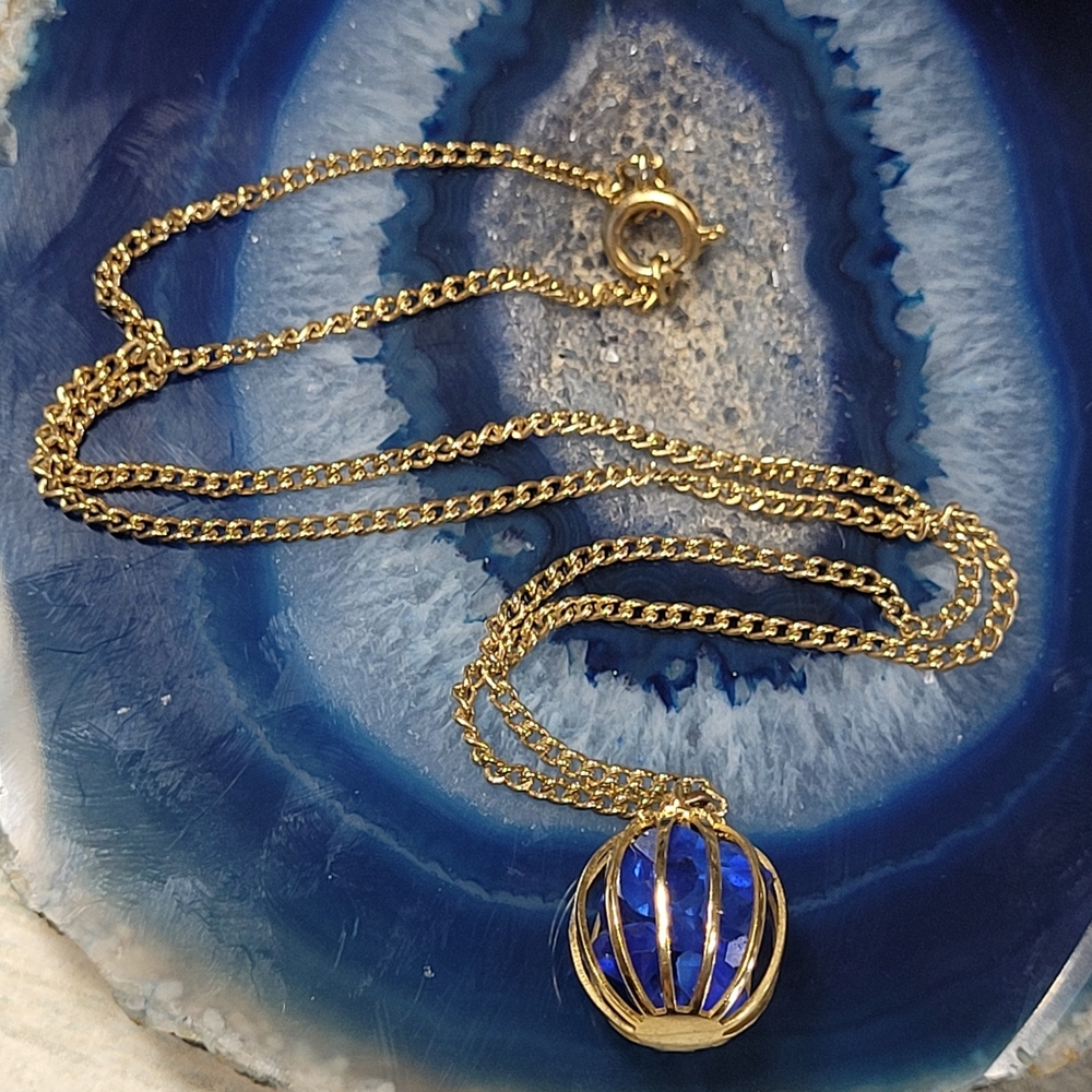 Blue stones in cage Necklace.